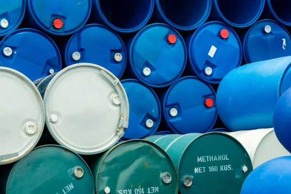 Old chemical barrels. Stack of blue methanol or methyl alcohol drum. Chemical tank. Toxic wast