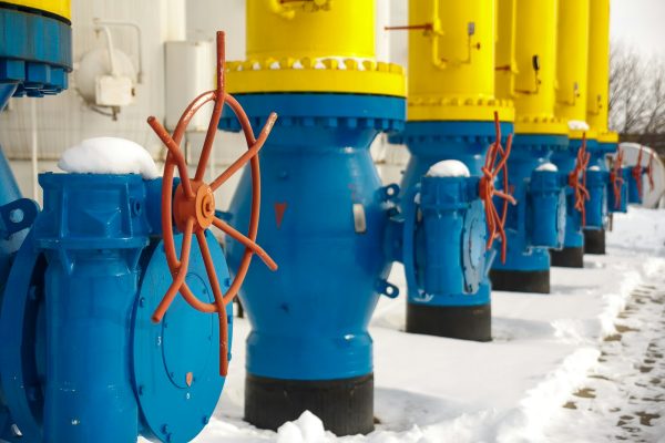 The valves for opening and closing the gas supplying at the gas compressor station in winter. Blue