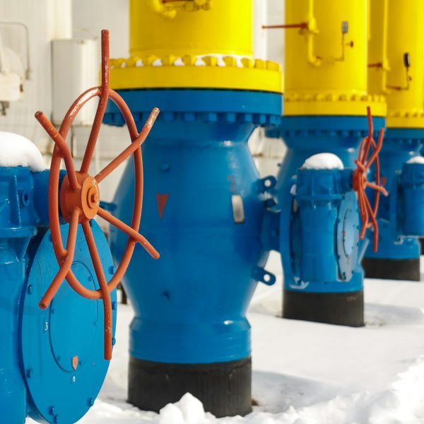 The valves for opening and closing the gas supplying at the gas compressor station in winter. Blue